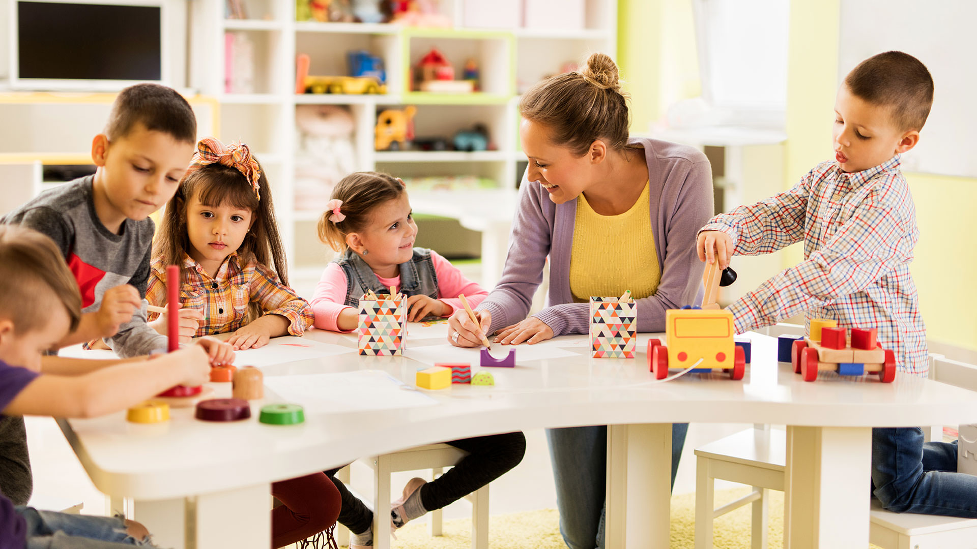 Teacher working with children in classroom