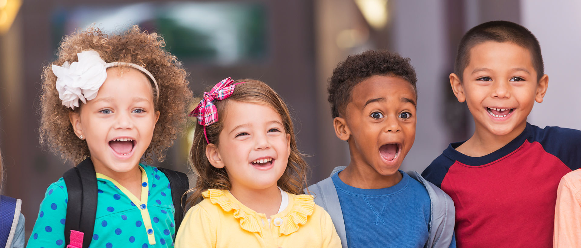 Four children smiling