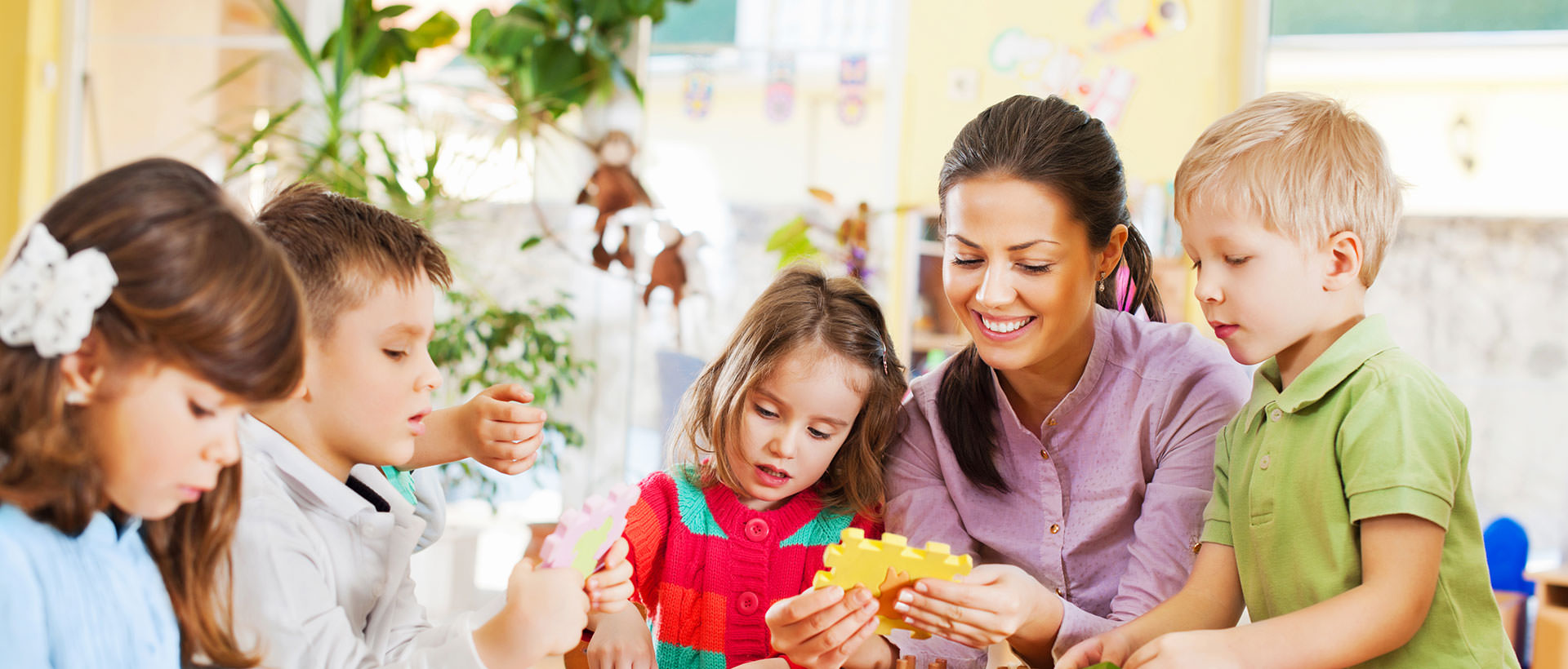 Children gathered around teacher