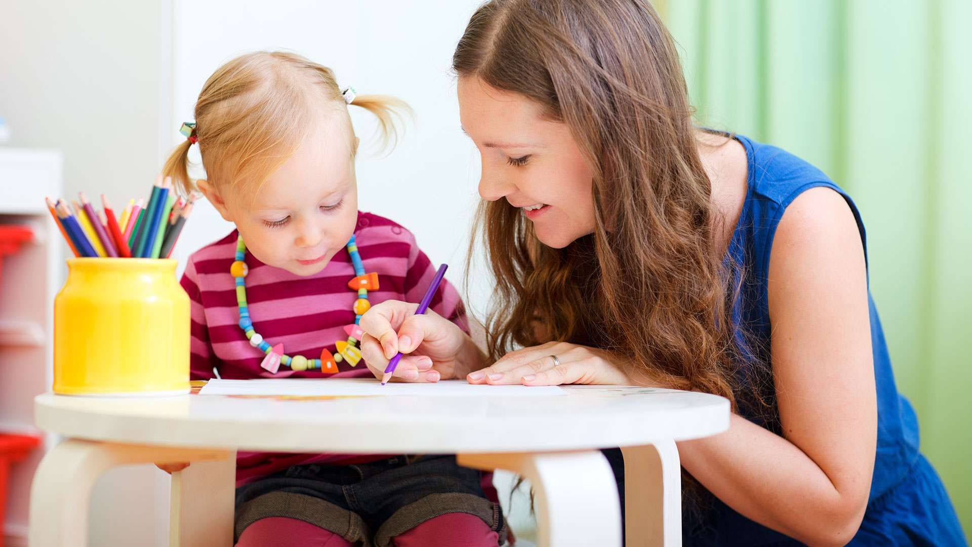 Teacher working with student